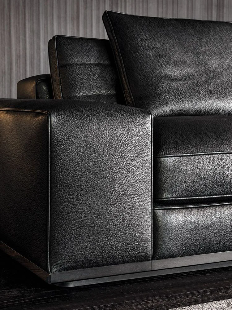 Black leather sofa after recolour and conditioning